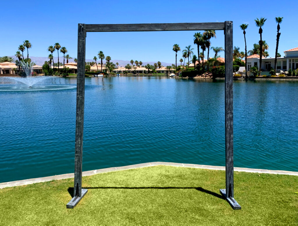 A pair of wedding arch with a water background